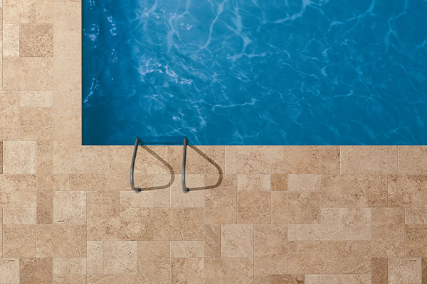Travertine effect tiles swimming pool