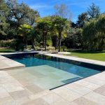 Swimming pool with Californian beach - Tiber, travertine effect tiles
