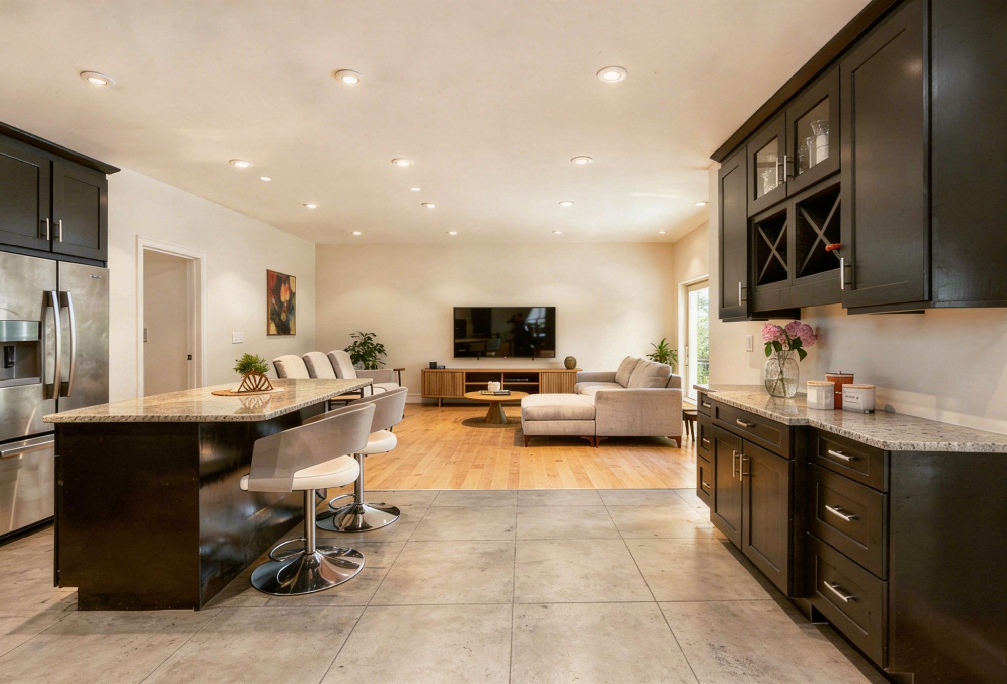 open-plan kitchen with wood effect tiles and concrete effect tiles