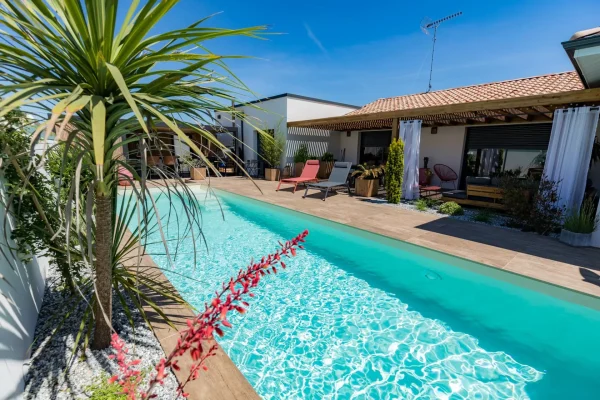 Wood-effect terrace and poolside area